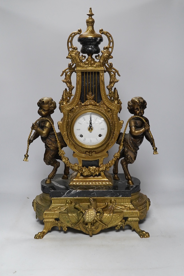 A bronze and marble three piece garniture, key, no pendulum, 69cm. Condition - good, not tested as working